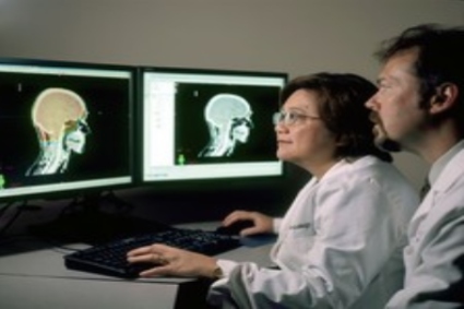 two doctors looking at the screen 