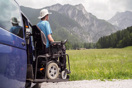 Man in wheelchair looking at mountains