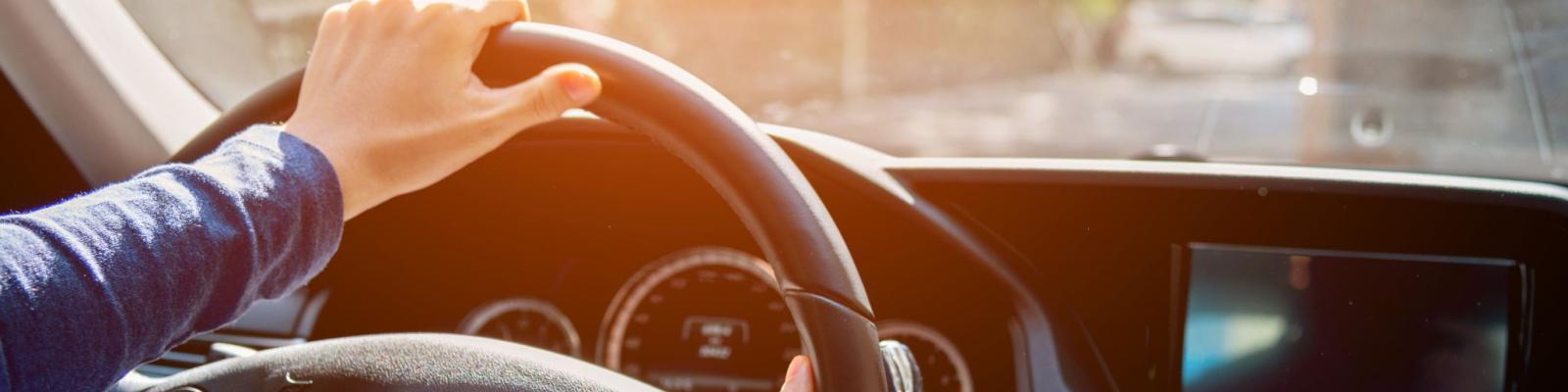 Photo of hands on steering wheel