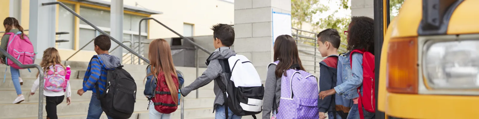 Photo of children exiting a school bus