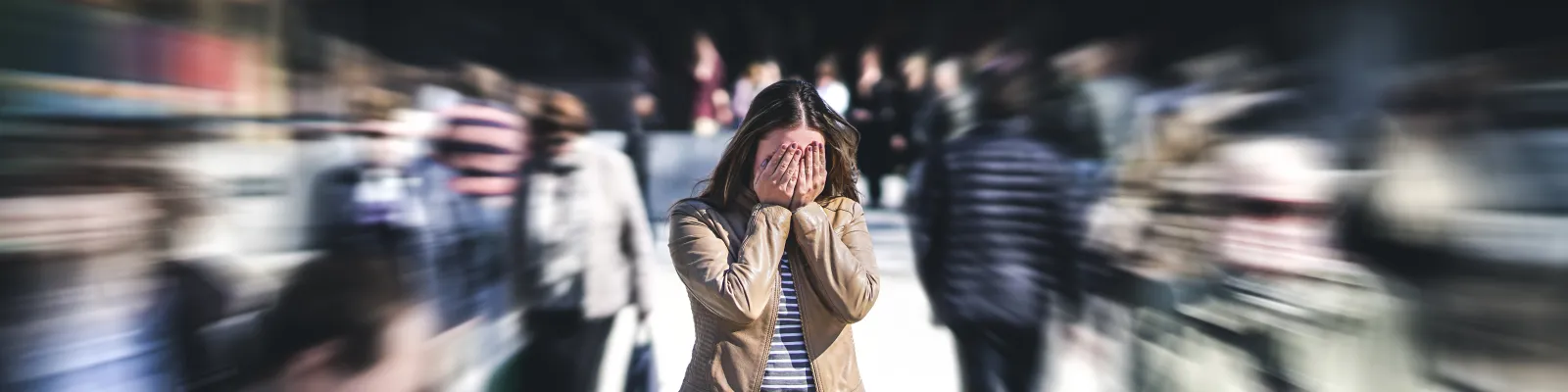 Photo of woman in crowd, overwhelmed