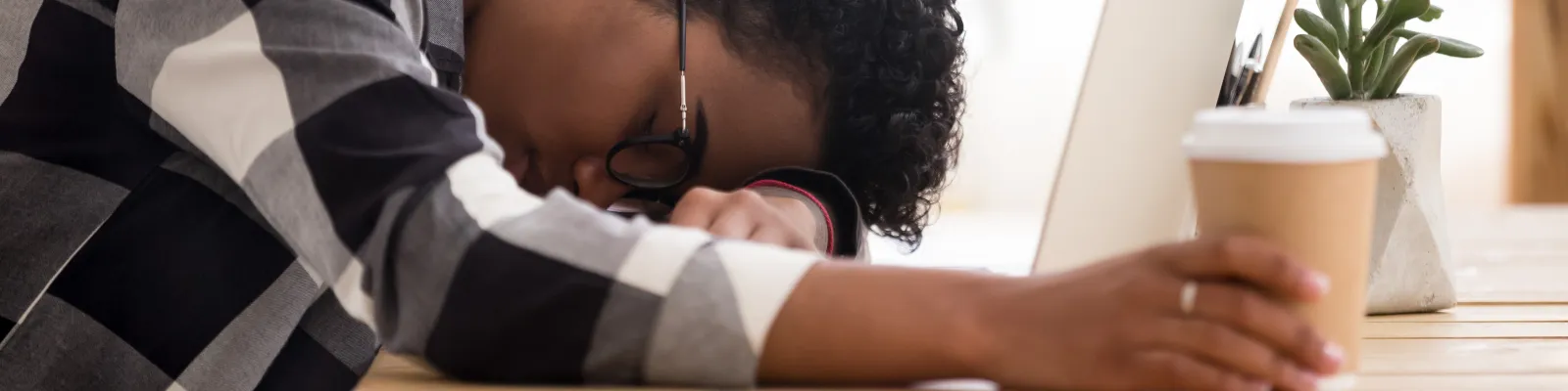 Photo of person asleep at computer
