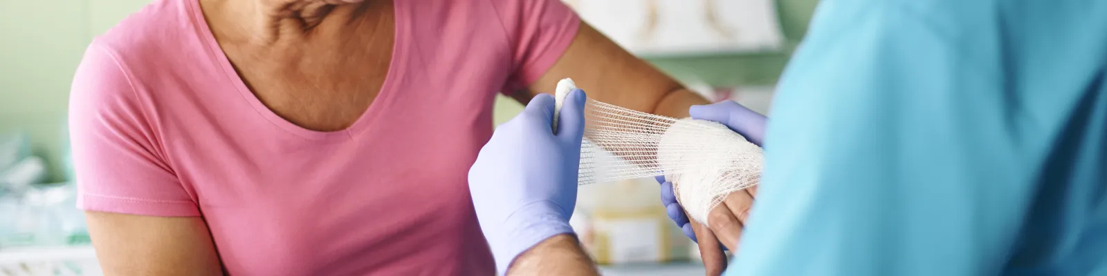 Photo of clinician dressing a burn wound