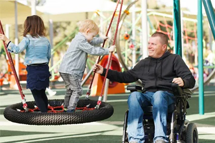 Dad playing with son and daughter