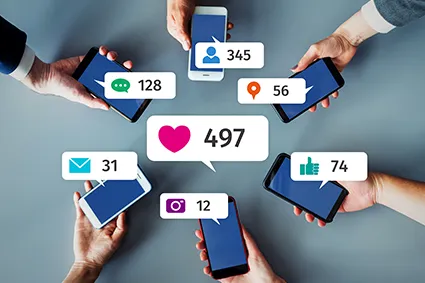 Photo of hands holding phones with social media