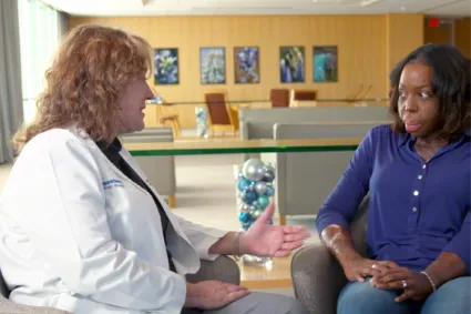 Clinician and patient talking.