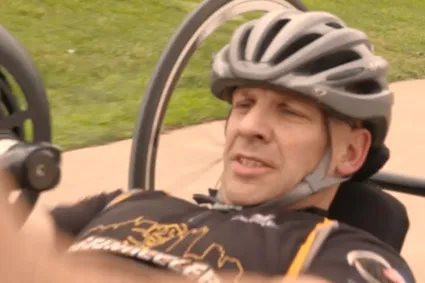 Man with SCI operating a handcycle
