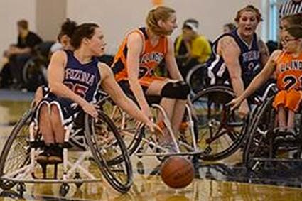 A group of women playing wheelchair basketball