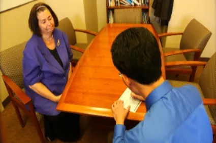 Two people sitting in a meeting room