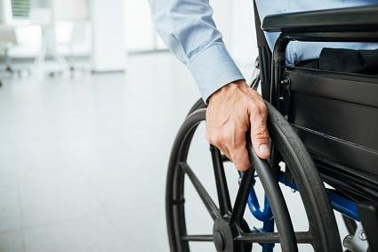 close-up of hand on wheelchair