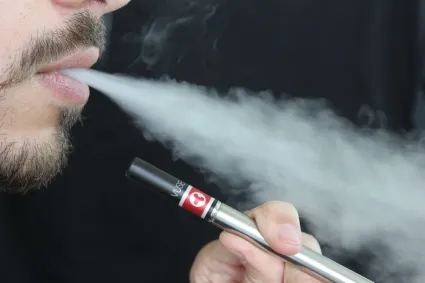 person smoking E-Cigarette