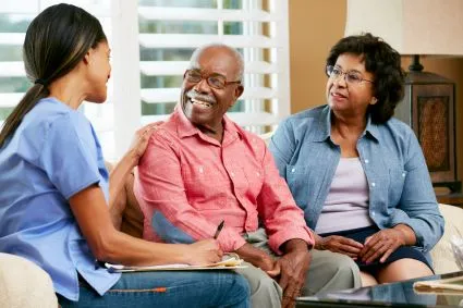 Group of three people sitting together on a couch