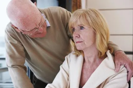 Older man with arm around woman