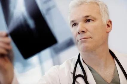 Clinician looking at x-ray