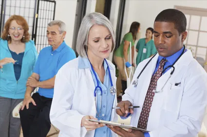 Doctors discussing a chart