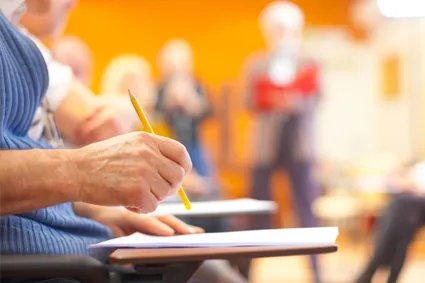 Student taking test at desk