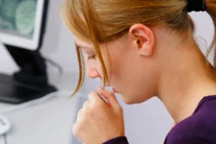 Person coughing into closed fist