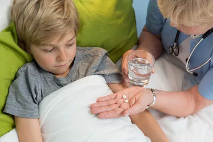 Child taking medicine