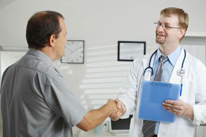 Patient and doctor shaking hands