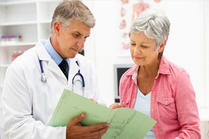 Doctor going over chart with patient 
