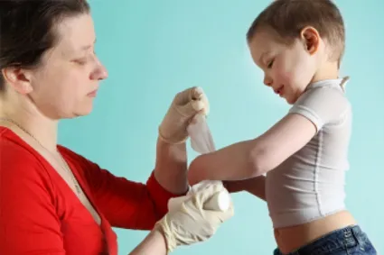 Bandaging child's writsts