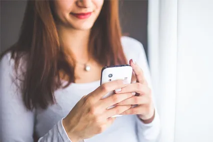 Person texting on phone