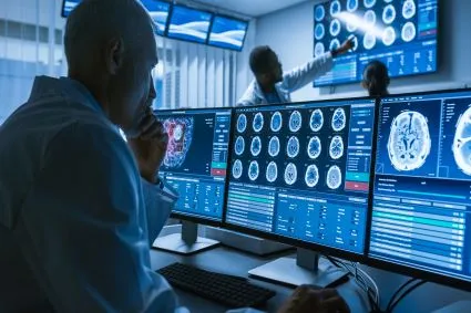 Clinician looking at brain scans on the computer