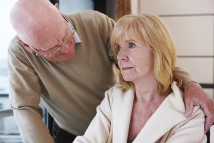 Concerned couple embracing