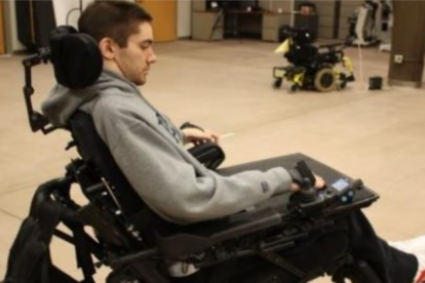 Man operating a power wheelchair