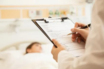 Doctor looking at chart