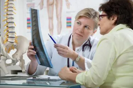 Doctor showing xray to woman