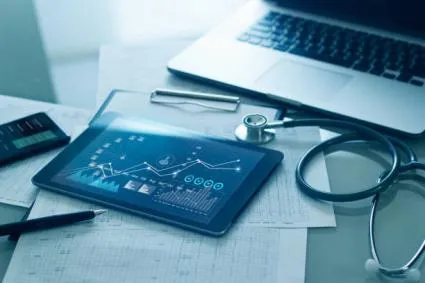 iPad with medical graphs on screen