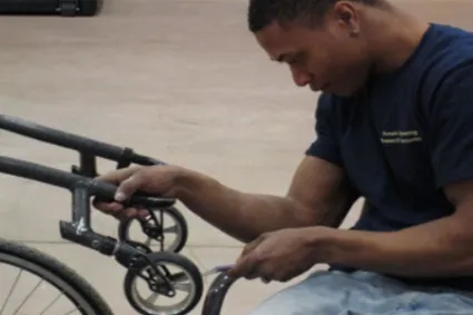 Man working on his manual wheelchair