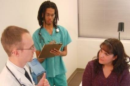 Woman being consulted by doctor