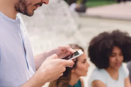 Photo of man on smartphone 