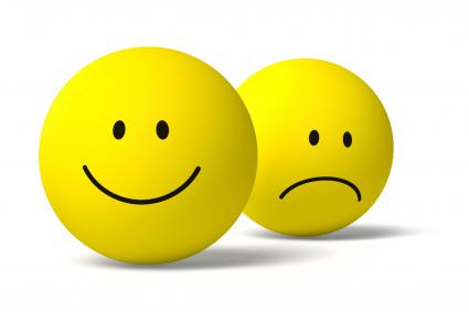 Photo of smiley face with frowning face