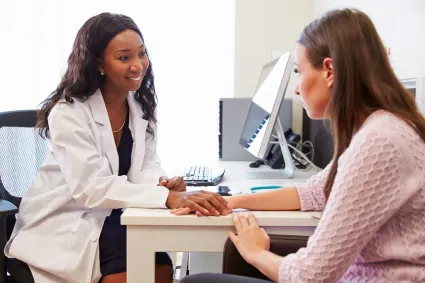 Photo of therapist speaking to patient