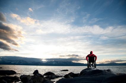 Photo of person in wheelchair on a beach