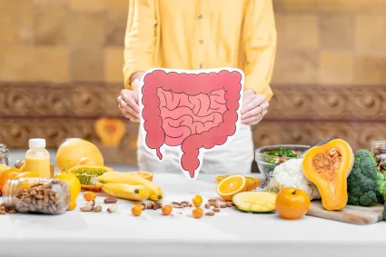 Photo of woman with food plus illustration of bowel