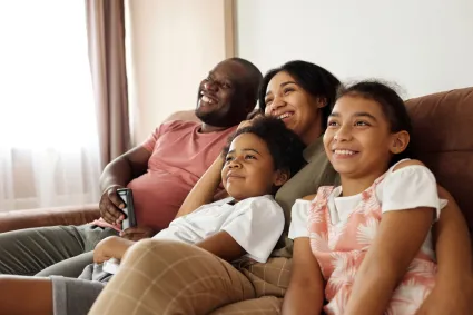 Photo of family sitting on couch