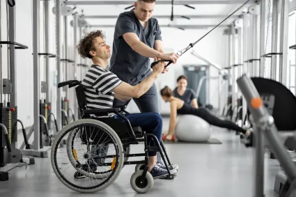 Photo of man in wheelchair exercising