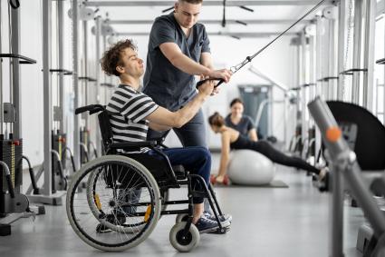 Photo of man in wheelchair exercising