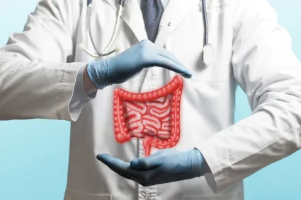 Photo of clinical staff with illustration of bowel