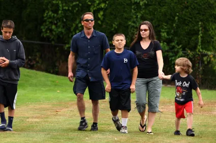 Photo of man with burn injury and his family