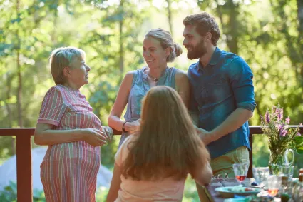 Photo of family having dinner outside