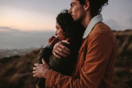 Photo of couple looking into the horizon