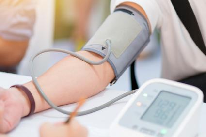 Photo of person with blood pressure cuff on the arm