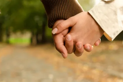 Photo of couple holding hands