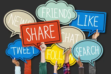 Photo of hands holding up speech bubble signs that say share, twee, friends, like, search, chat