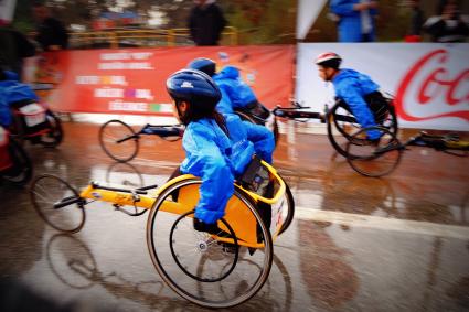 Photo of group of people in hand cycling race